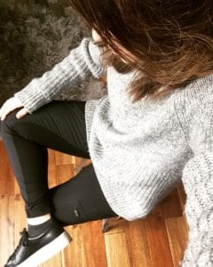 My eight outfit for the wardrobe challenge and I'm wearing an oversized grey sweater with black leggings and black sneakers.