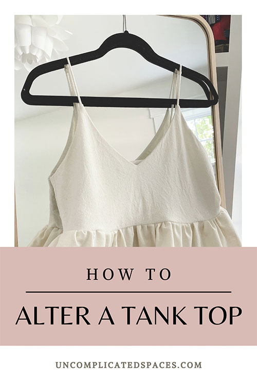 An image of the tank top hanging on a mirror with the words "how to alter a tank top" over the bottom. 