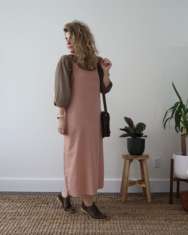 Mini capsule outfit 4 - a pink slip dress over the tan tunic with brown Oxford flat shoes and a brown handbag on my shoulder.