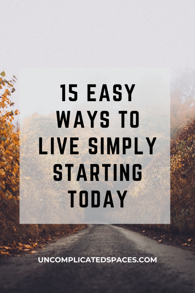 Text that reads "15 easy ways to live simply starting today" is overlaid on top of a photo of a first road with autumn foliage on the sides of the road.