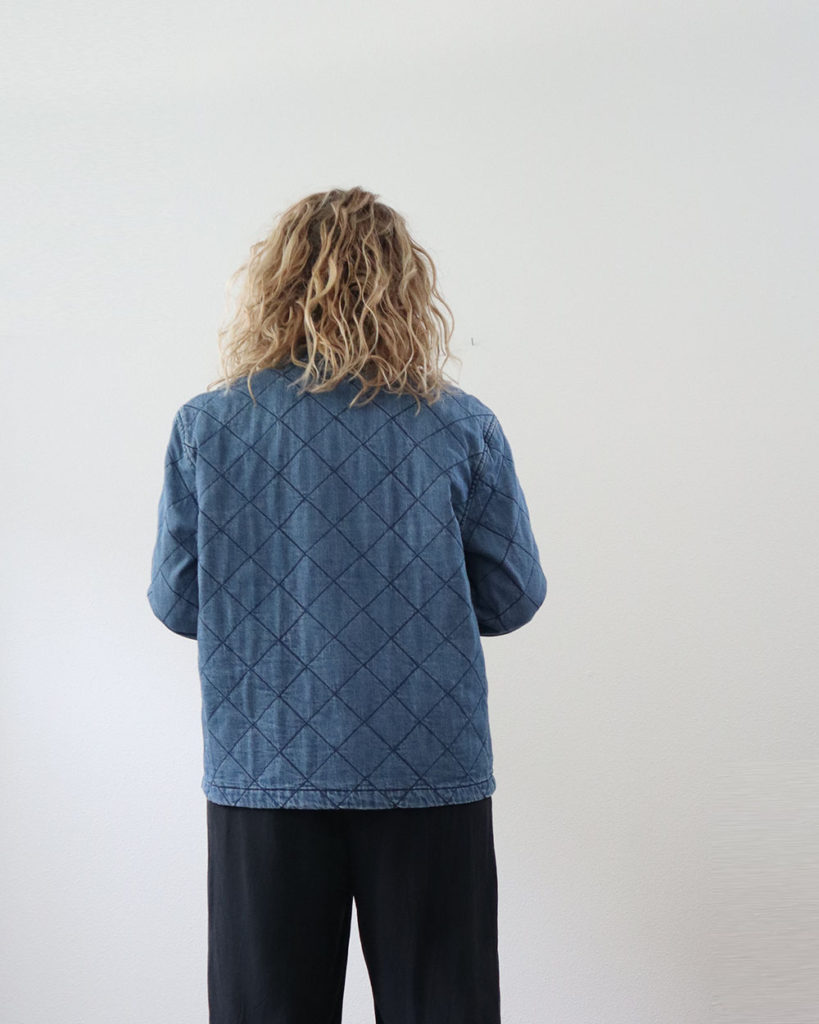 The back view of the denim quilted coat.
