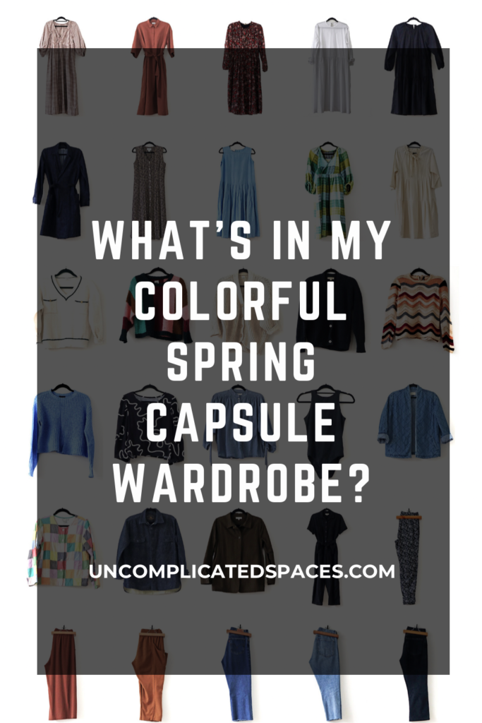 The same image as the one above showing all of the capsule items laid out but now there is a transparent black rectangle overlaid on top with the text "what's in my colorful spring capsule wardrobe?"