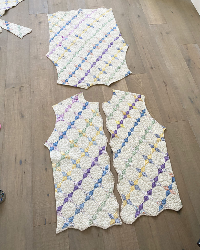 3 pattern pieces that have been cut from the vintage quilt...2 front pieces and a large back piece.