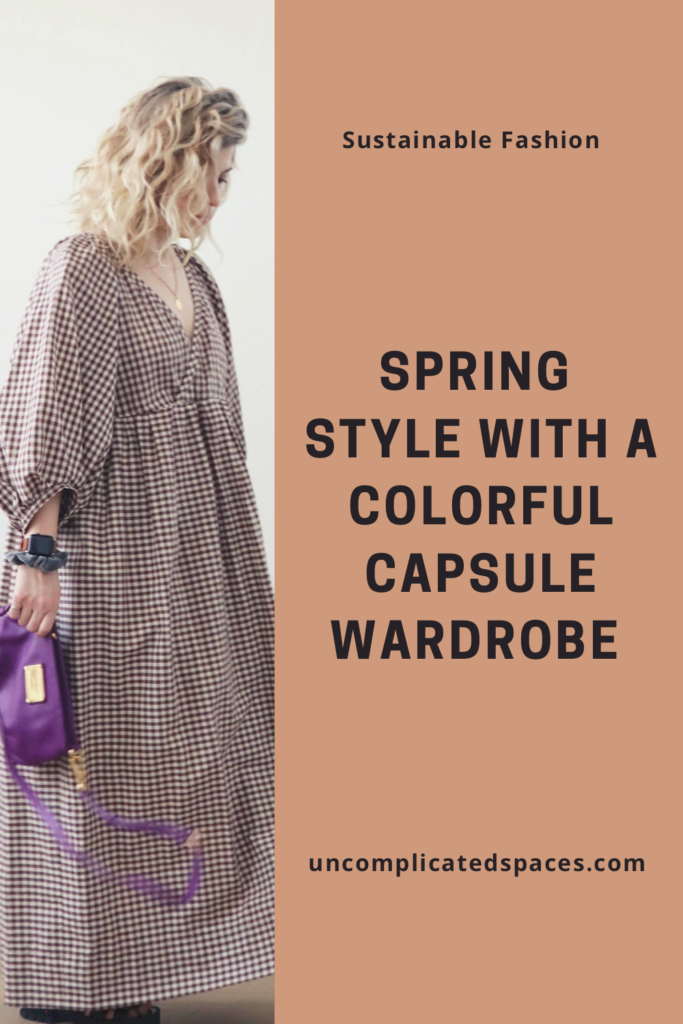 One half of the image is a white woman with blond wavy hair wearing a brown and white checkered dress and holding a purple handbag. The other half is a brown background with black text on top that reads "Spring Style with a colorful capsule wardrobe".