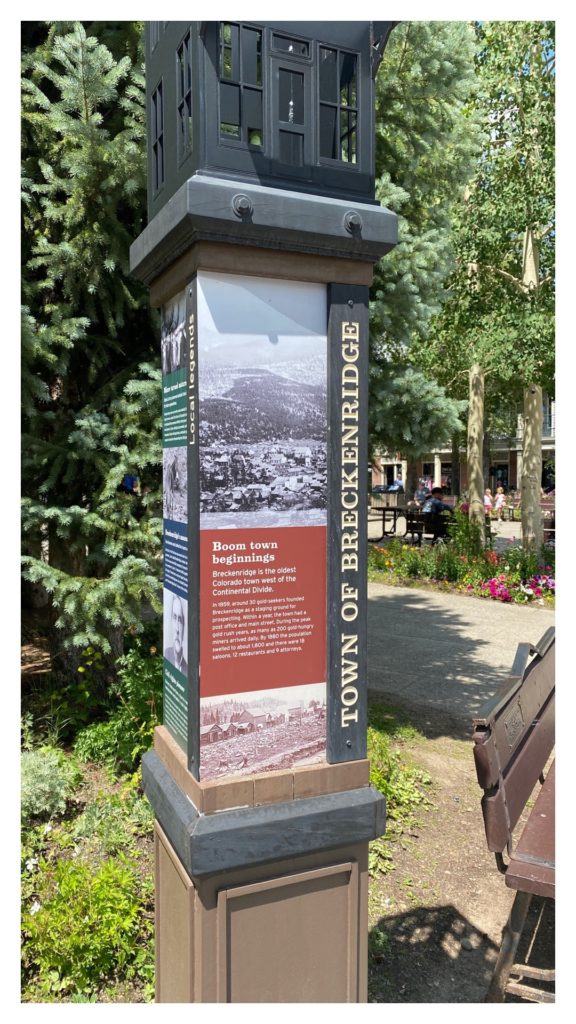 A post with the "Town of Breckenridge" written on it. There are some pictures and written history about the town.