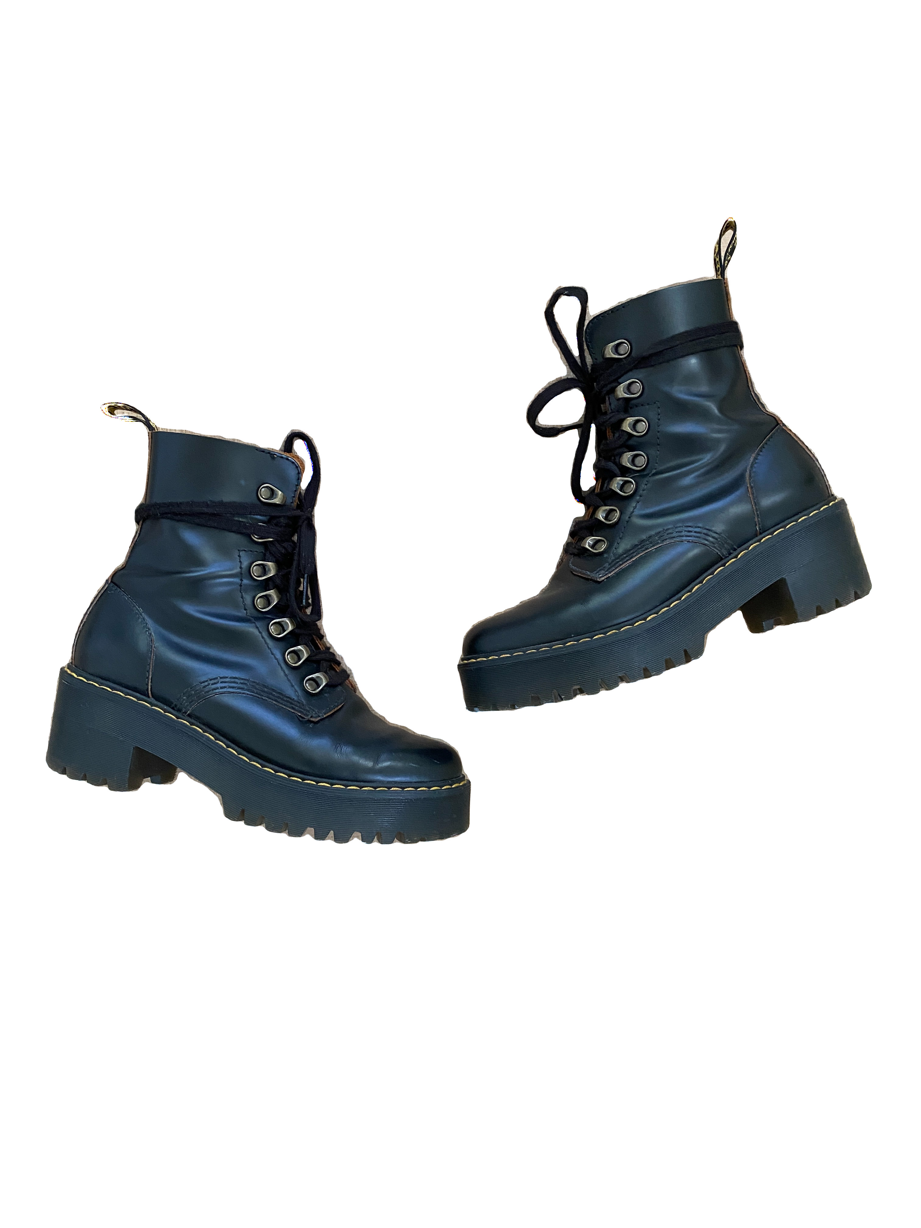 A pair of black combat boots that I've included in my fall shoe capsule are silhouetted against a white background with text alongside them.